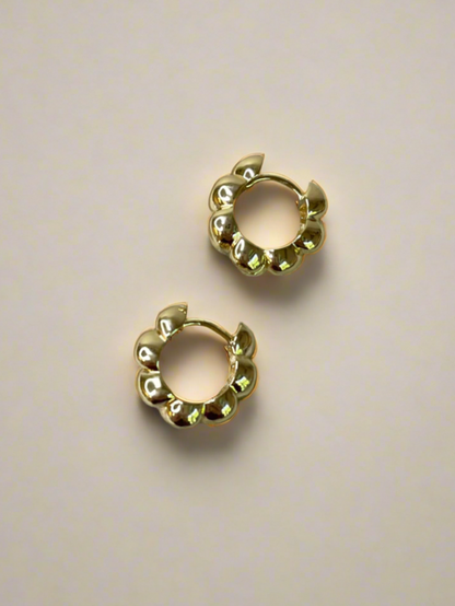 Radiant Twist Gold Dipped Huggie Earrings